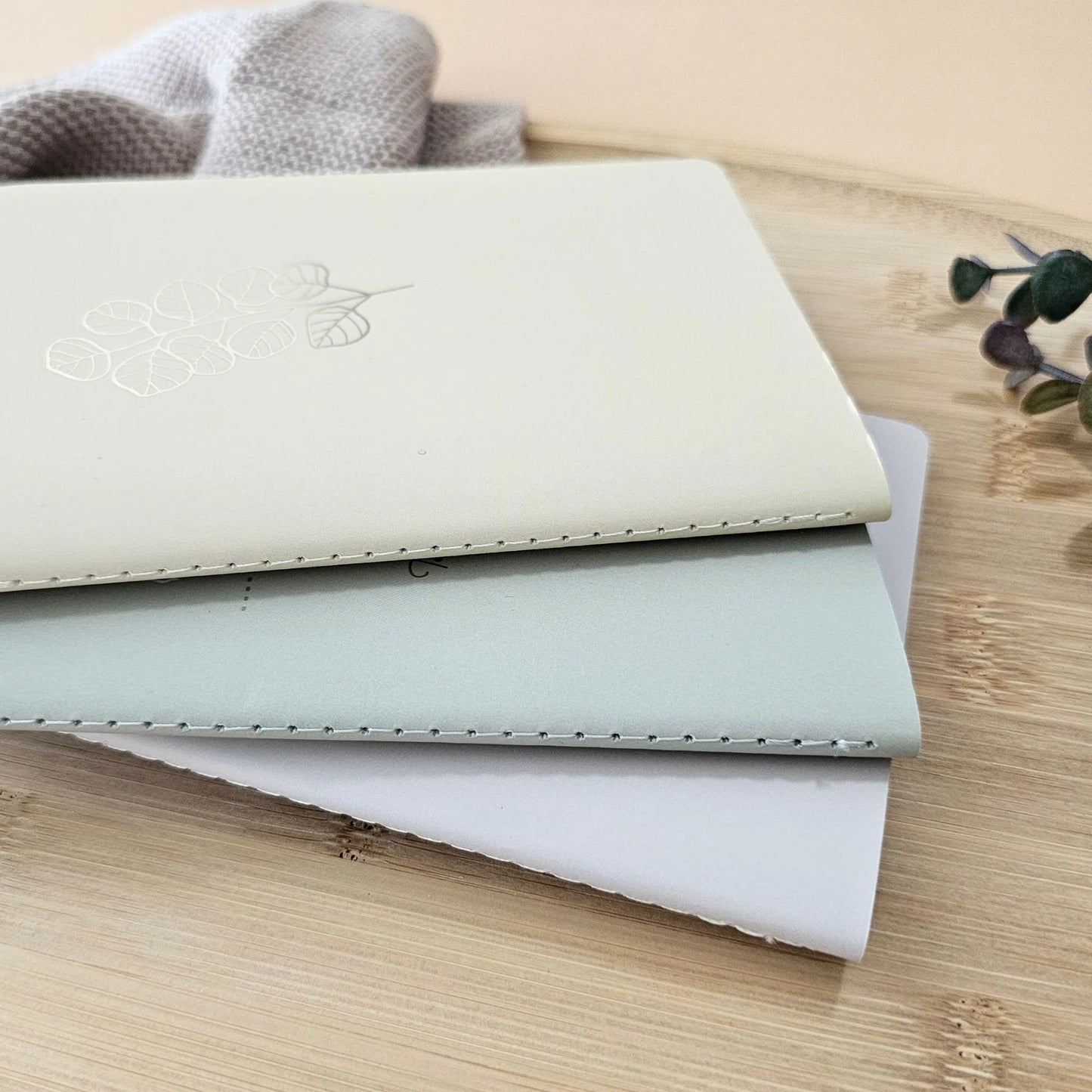 Artchemira A6 pocket journal trio in sage mist, warm sand, and muted rosy featuring premium stitching