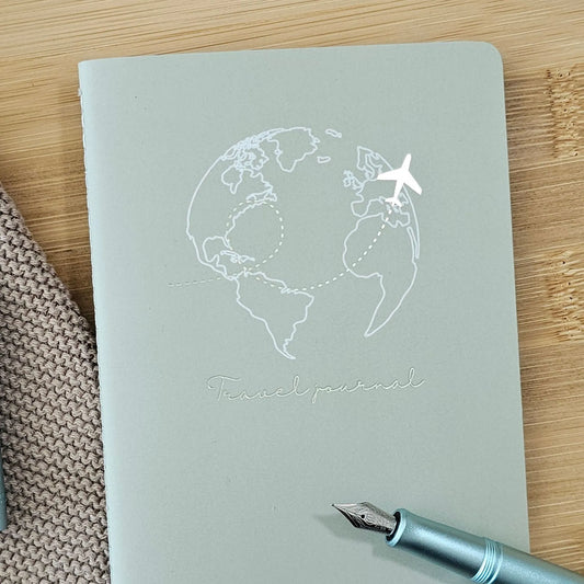 Artchemira A6 pocket  journal with champagne gold globe and plane foil illustration, sage green cover