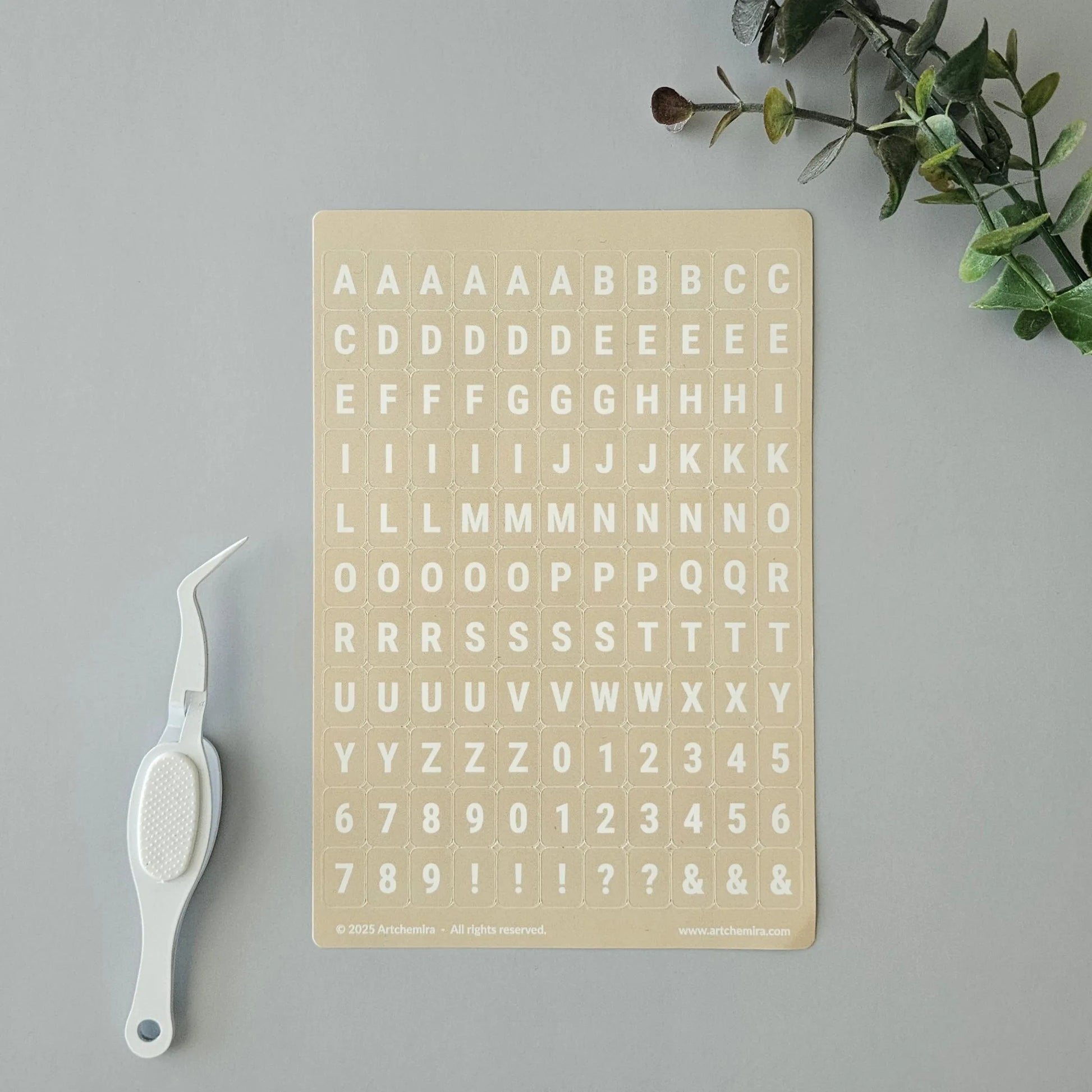 Artchemira pastel yellow alphabet sticker sheet with white crafting tweezer tool
