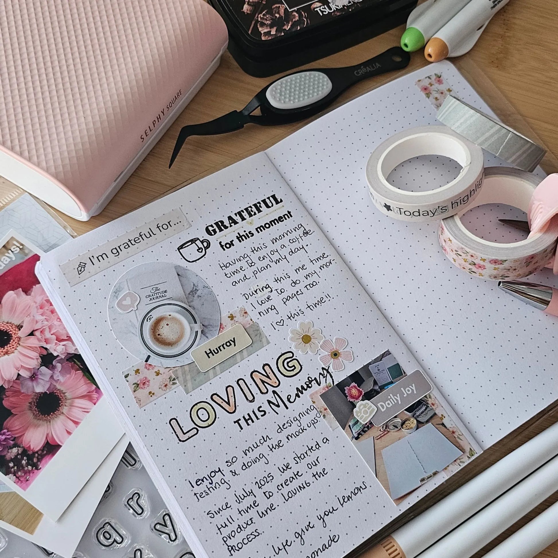 Artchemira open gratitude journal spread with handwritten entries, stickers, and creative layouts