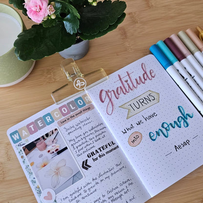 Artchemira open gratitude journal spread with stickers, markers, and colourful creative page layout
