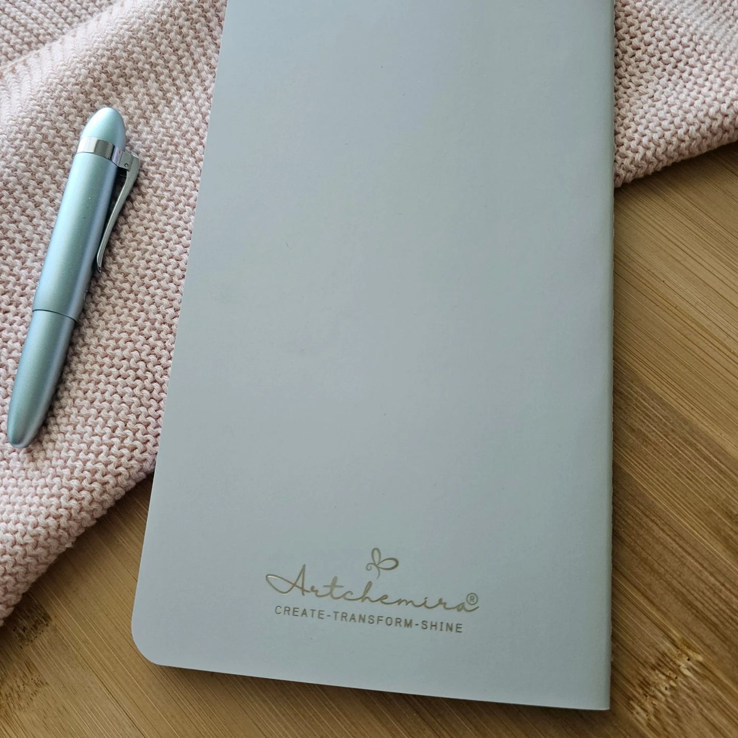 Artchemira large journal in sage green showing back cover with Artchemira logo, bamboo surface