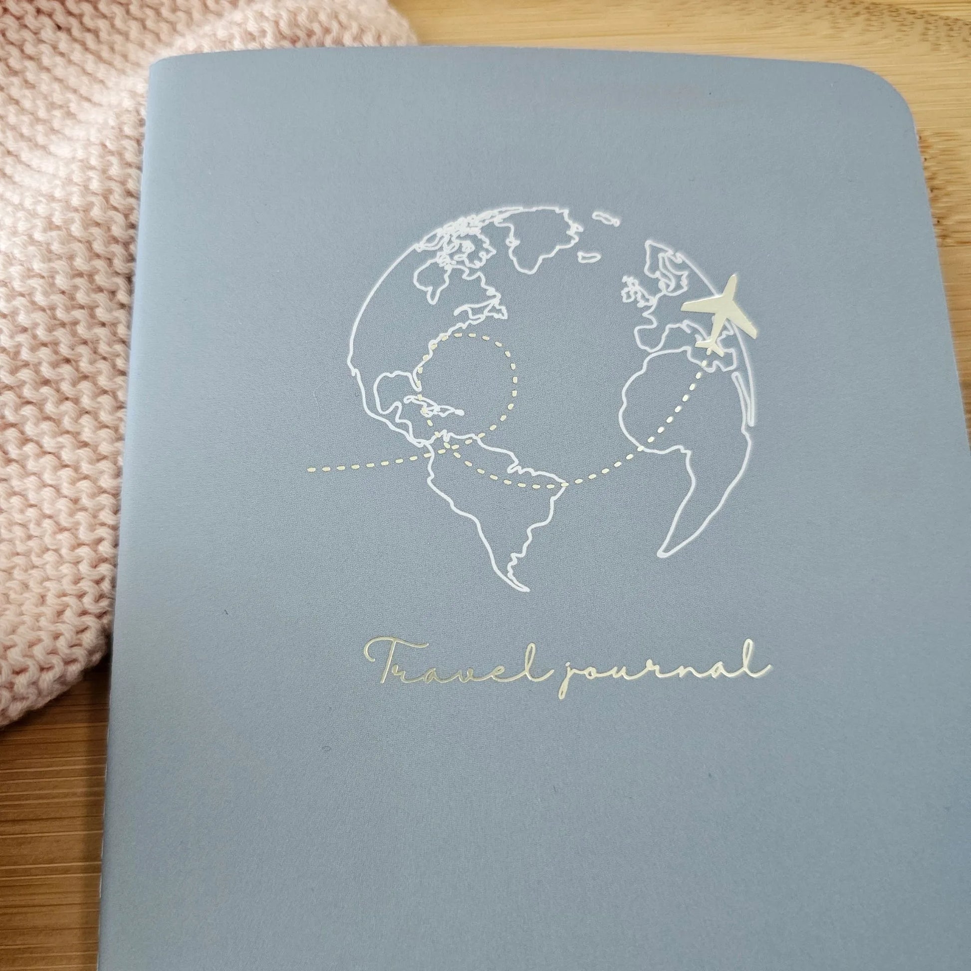 Artchemira large travel journal with champagne gold globe foil illustration, blue pen on bamboo
