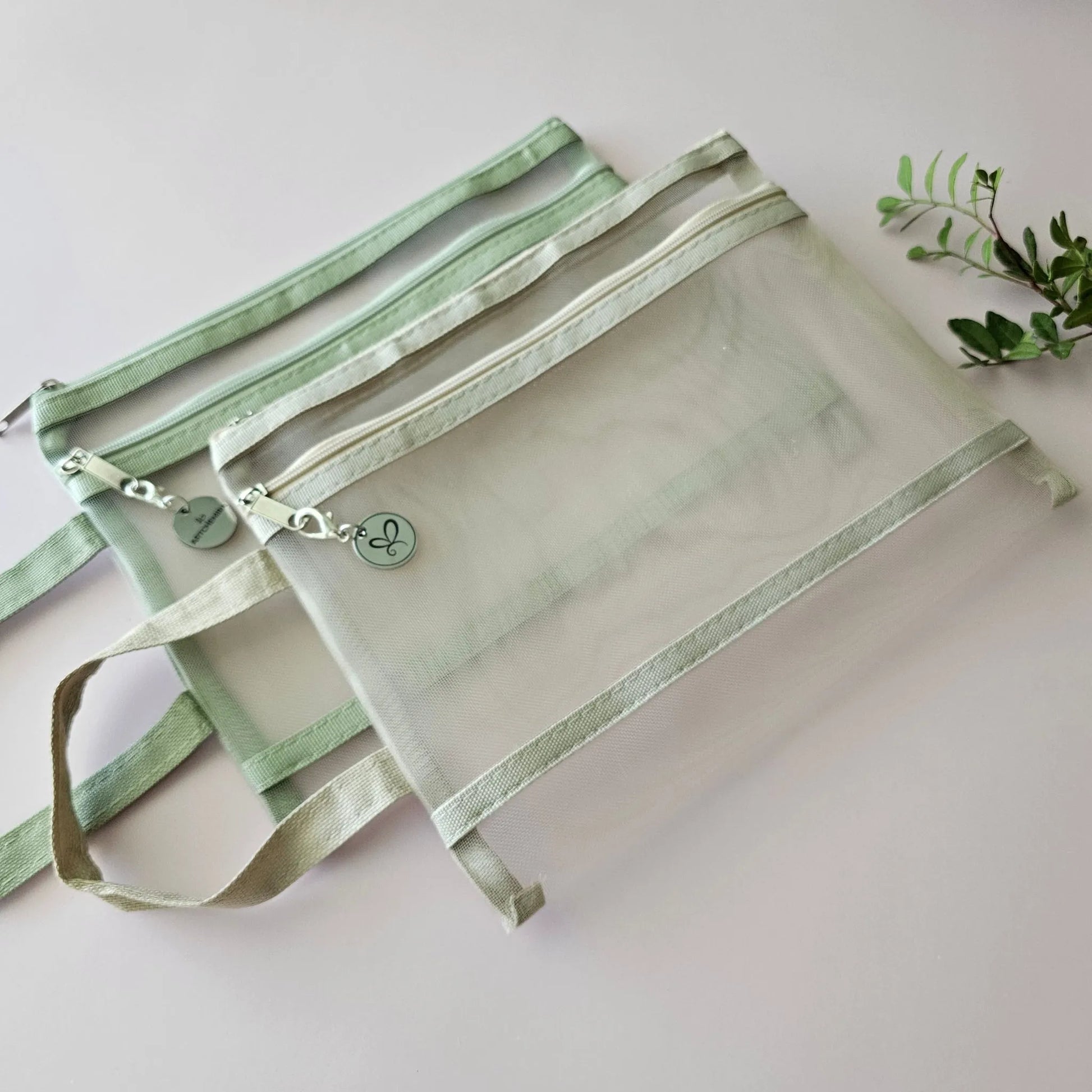Artchemira A5 nylon mesh journaling bags in pastel sage green and beige  with double zipper, side view