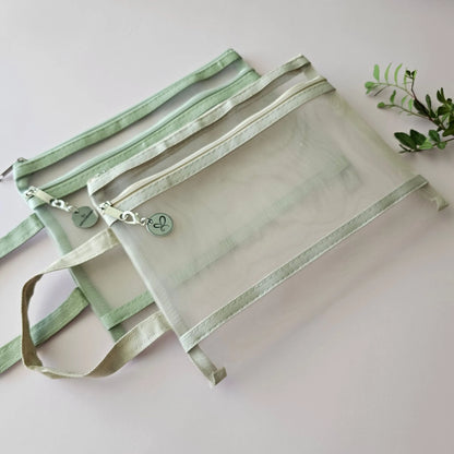 Artchemira A5 nylon mesh journaling bags in pastel sage green and beige  with double zipper, side view