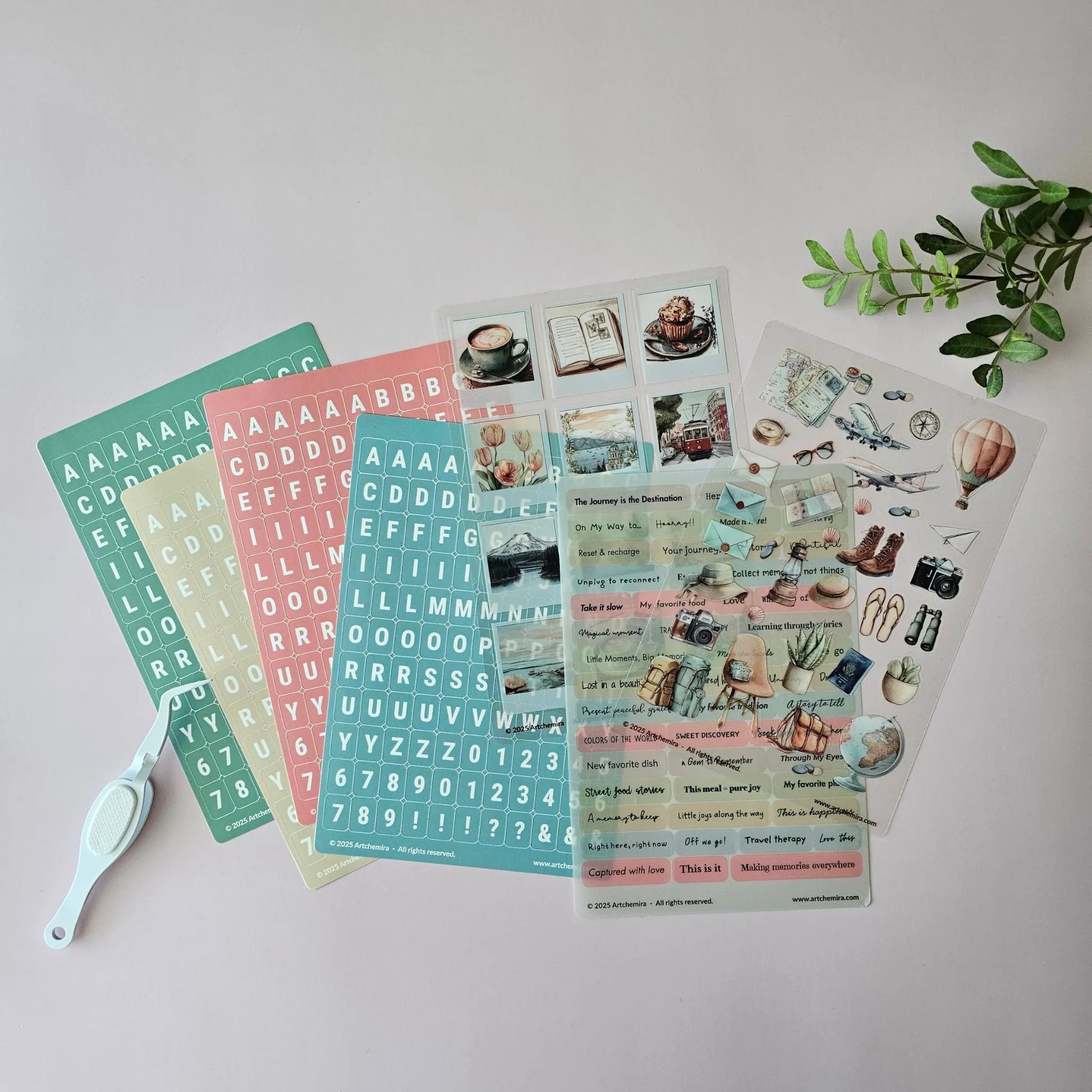 Artchemira travel collection with alphabet sticker sheet, decorative stickers, and sentiment stickers